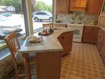 HOMECREST CABINETRY IN MAPLE W/ WILSONART COUNTERTOP Auction Photo