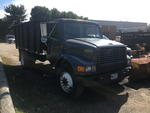 1997 INTERNATIONAL 4700 4X2 SINGLE AXLE CHIP TRUCK Auction Photo
