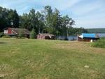 Glimmerglass Lodge 3+/-Acres - 342+/- Ft. Lake Frontage  (4) Rustic Cabins Auction Photo